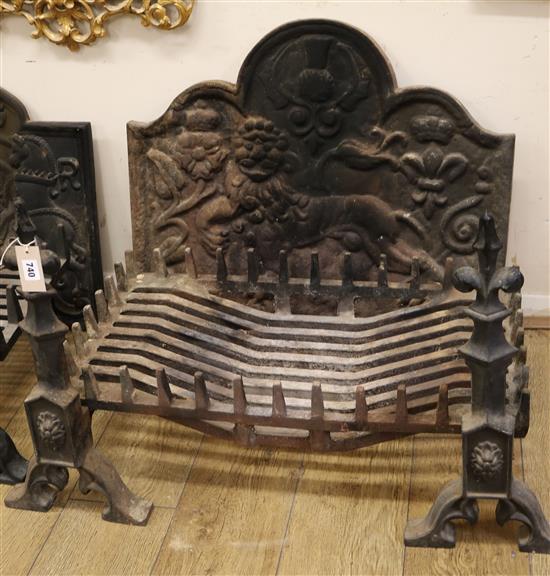 A cast iron fire-back, decorated with a lion rampant, together with a fire-back and fire dogs Basket W.75.5cm, Fireback W.76cm